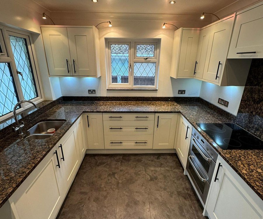 The same kitchen after spray painting, units in cream