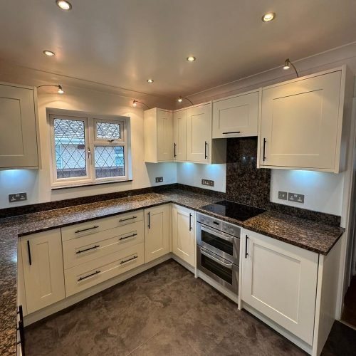 Kitchen units spray painted in cream with granite worktop